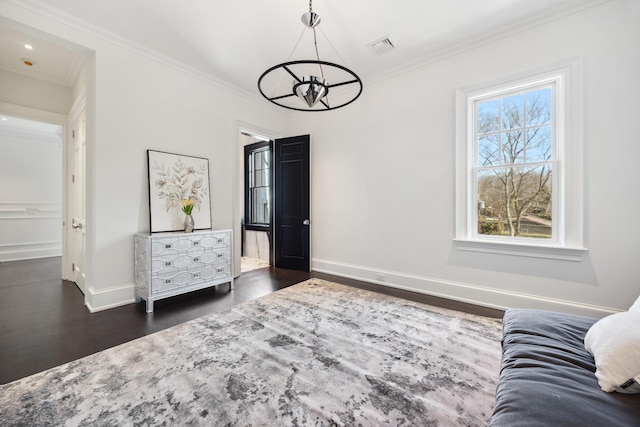 living area featuring crown molding, baseboards, an inviting chandelier, and dark wood finished floors