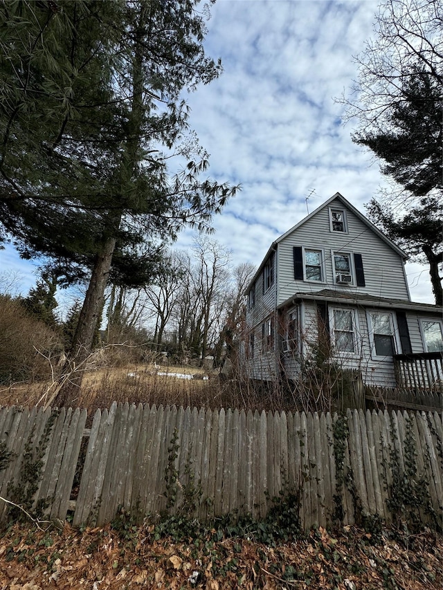 view of side of home featuring a fenced front yard