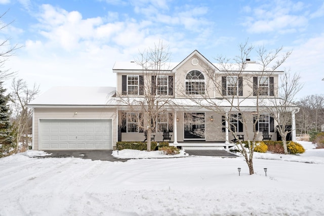 view of front of house featuring a porch, a chimney, and an attached garage