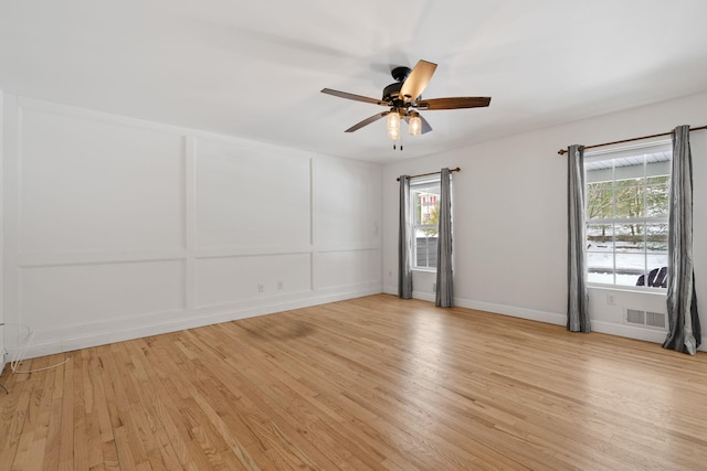 61 Surrey St, Rock Hill, NY 12775 - unfurnished room with light wood-style floors, a ceiling fan, and baseboards