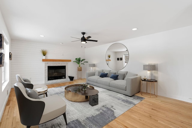 61 Surrey St, Rock Hill, NY 12775 - living area featuring ceiling fan, wood finished floors, a glass covered fireplace, baseboards, and recessed lighting