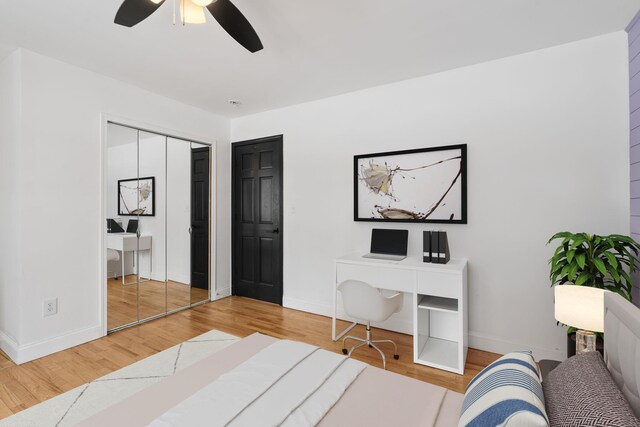 61 Surrey St, Rock Hill, NY 12775 - bedroom with wood finished floors, baseboards, a desk, a closet, and a ceiling fan