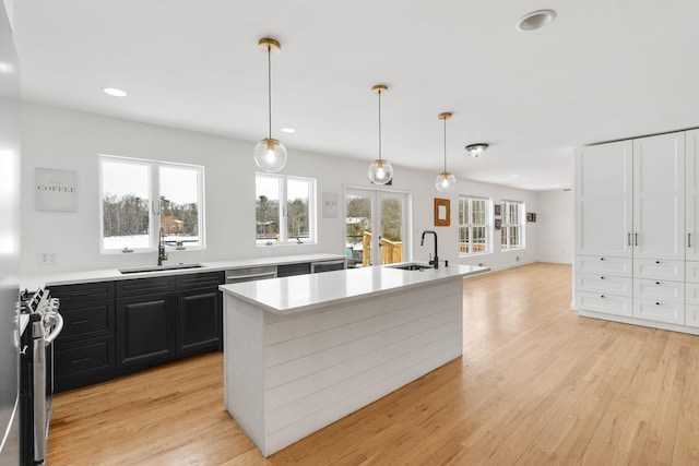 61 Surrey St, Rock Hill, NY 12775 - kitchen with a sink, dark cabinetry, light countertops, stainless steel appliances, and recessed lighting
