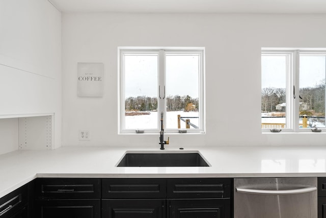 61 Surrey St, Rock Hill, NY 12775 - kitchen with stainless steel dishwasher, a sink, dark cabinets, and light countertops
