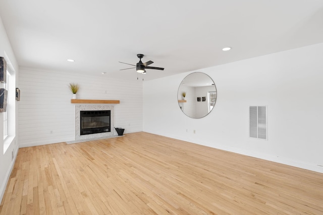 61 Surrey St, Rock Hill, NY 12775 - unfurnished living room with light wood finished floors, a ceiling fan, a fireplace with flush hearth, recessed lighting, and baseboards