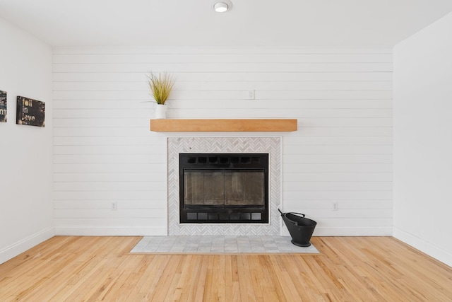61 Surrey St, Rock Hill, NY 12775 - detailed view of baseboards, wood finished floors, and a tile fireplace