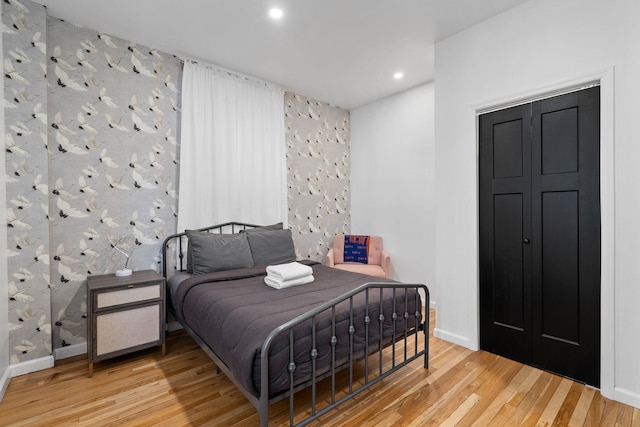 bedroom featuring recessed lighting, baseboards, and wood finished floors