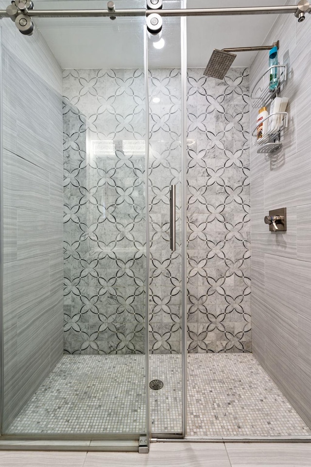 full bathroom with a shower stall