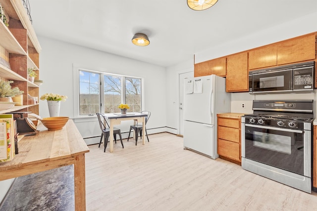 kitchen featuring light wood-style flooring, a baseboard heating unit, baseboards, black appliances, and brown cabinetry