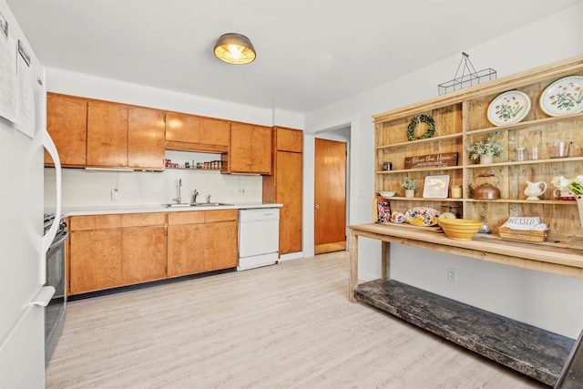 kitchen featuring white dishwasher, light countertops, light wood-style floors, open shelves, and a sink