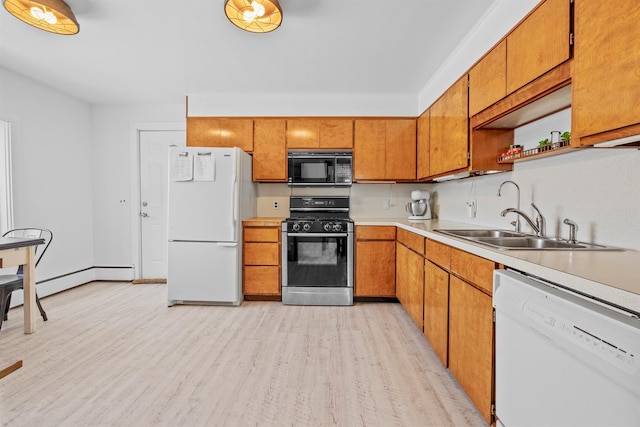 kitchen with white appliances, a sink, light countertops, open shelves, and light wood finished floors