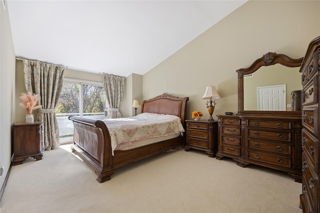 bedroom featuring access to outside, light carpet, and vaulted ceiling