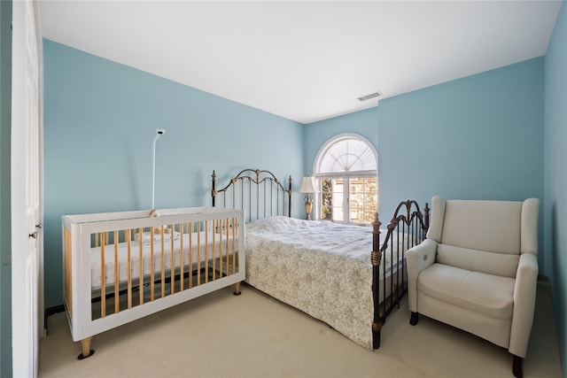 bedroom with carpet flooring and visible vents