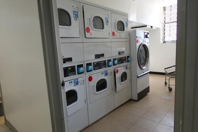 common laundry area with washing machine and clothes dryer and stacked washer and clothes dryer