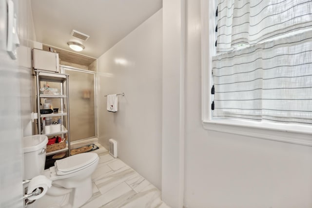 full bath featuring toilet, marble finish floor, a stall shower, and visible vents