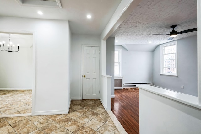 interior space with recessed lighting, a textured ceiling, baseboards, and ceiling fan with notable chandelier