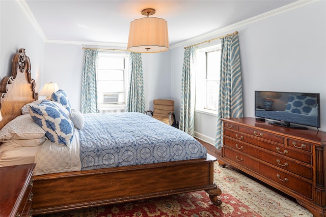 bedroom featuring light wood-type flooring, cooling unit, crown molding, and baseboards