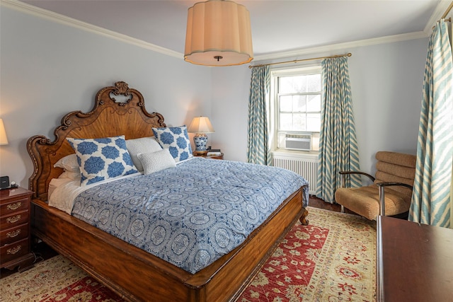 bedroom featuring radiator heating unit, ornamental molding, and cooling unit