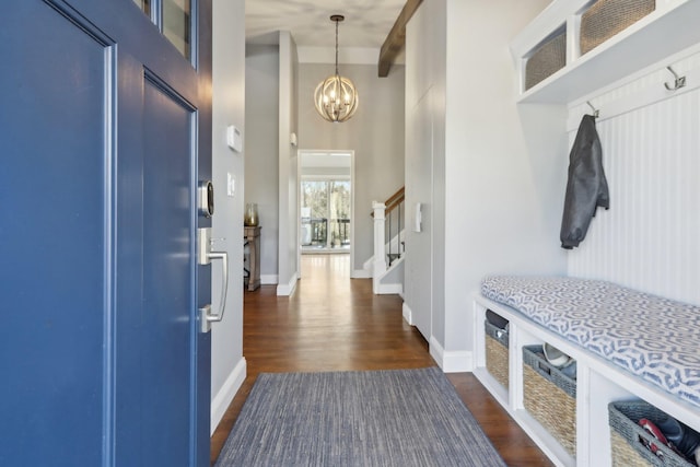 mudroom with baseboards, a high ceiling, a chandelier, and dark wood-style flooring