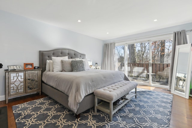 bedroom with access to outside, dark wood-style flooring, and recessed lighting