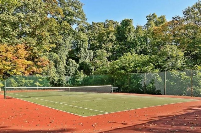 view of sport court with fence