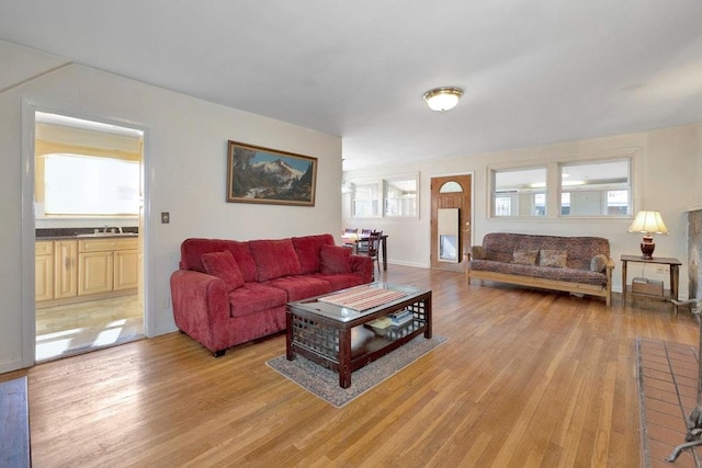 living area featuring plenty of natural light and light wood-style flooring