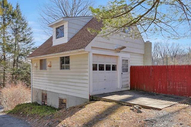 garage with fence