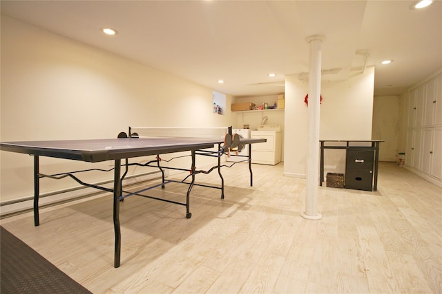 playroom with light wood-type flooring, washer and clothes dryer, and recessed lighting