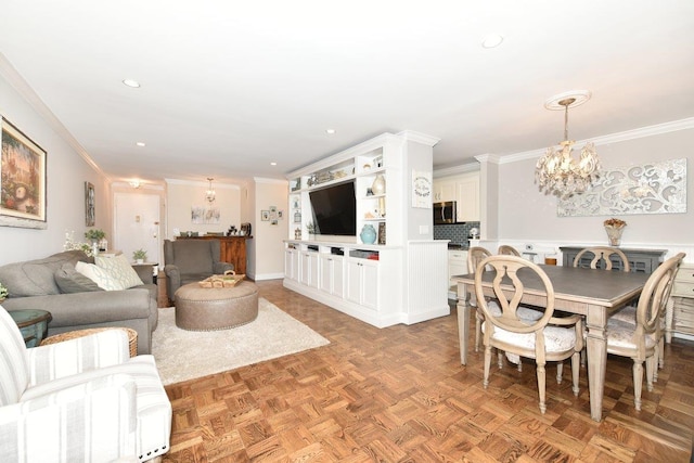 living area featuring ornamental molding, recessed lighting, and an inviting chandelier