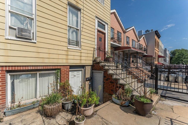 view of front of house with fence and brick siding