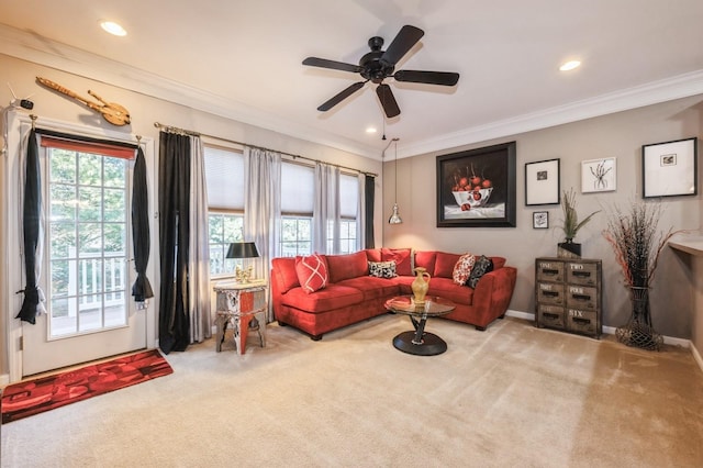 living room with carpet floors, a healthy amount of sunlight, and ornamental molding