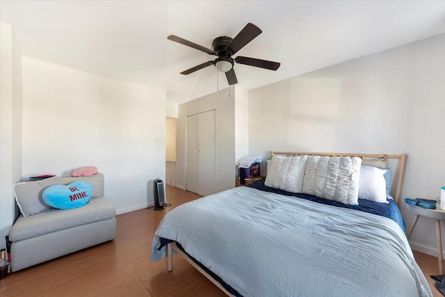 bedroom featuring ceiling fan and baseboards