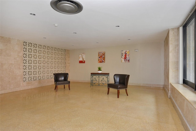 unfurnished room with baseboards, light speckled floor, and recessed lighting