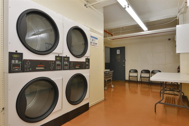 shared laundry area featuring stacked washer / dryer