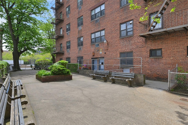 view of building exterior with fence