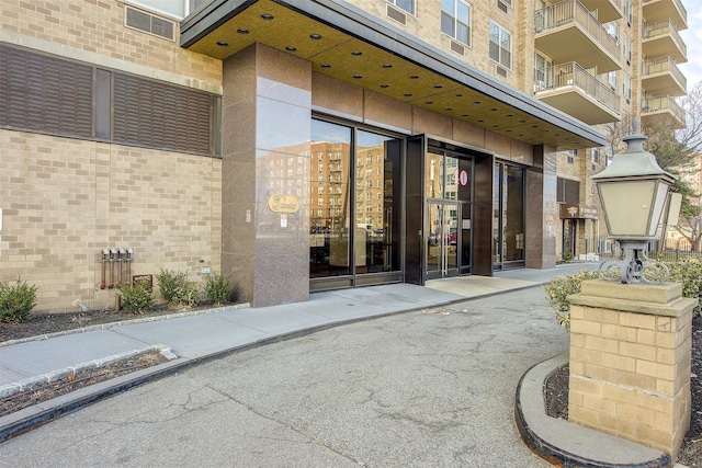 entrance to property with brick siding