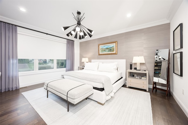 bedroom featuring baseboards, recessed lighting, wood finished floors, and crown molding