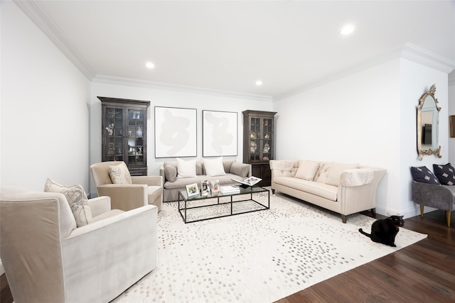 living room with ornamental molding, recessed lighting, baseboards, and wood finished floors