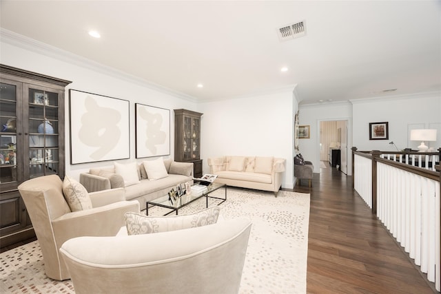 living room featuring crown molding, visible vents, dark wood-type flooring, and recessed lighting