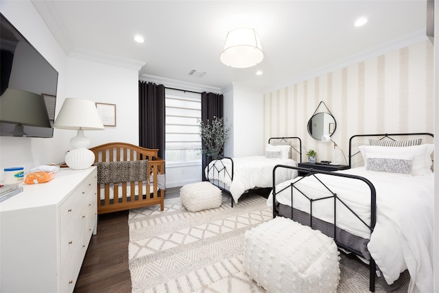 bedroom featuring visible vents, dark wood finished floors, crown molding, and recessed lighting