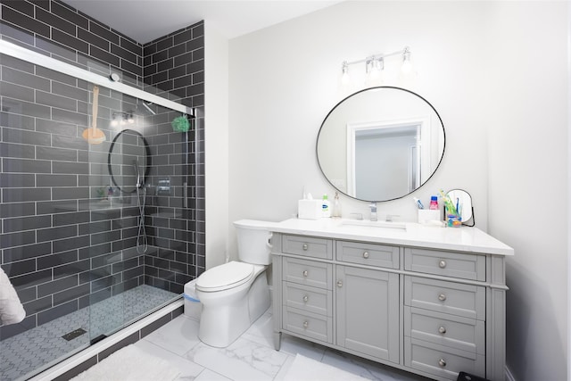 full bathroom with toilet, marble finish floor, a shower stall, and vanity