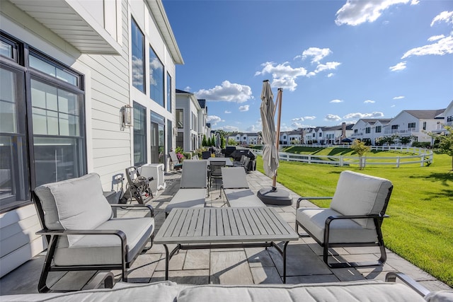 view of patio / terrace featuring a residential view and an outdoor living space