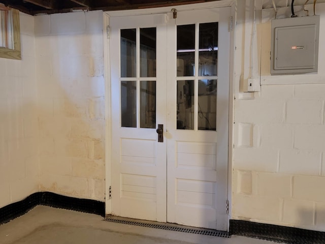 view of exterior entry featuring electric panel and french doors