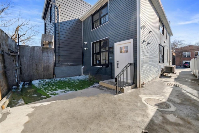 back of house featuring central air condition unit, a patio area, and fence