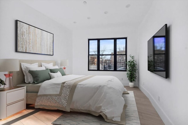 953 Tilden St, Bronx, NY 10469 - bedroom with baseboards and light wood finished floors