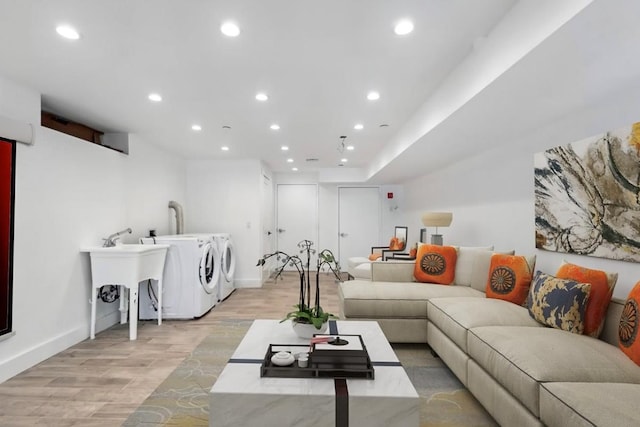 953 Tilden St, Bronx, NY 10469 - living room featuring light wood finished floors, baseboards, washer and clothes dryer, and recessed lighting
