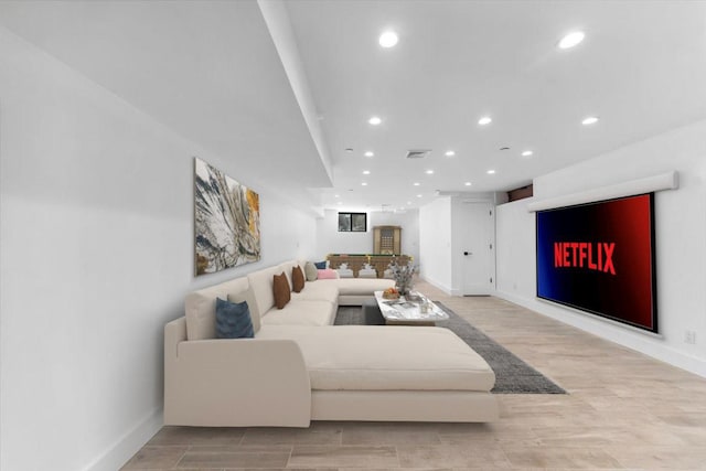 953 Tilden St, Bronx, NY 10469 - living area featuring light wood finished floors, baseboards, visible vents, and recessed lighting
