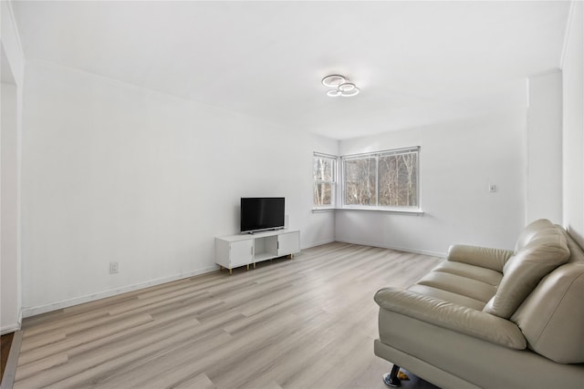 living room with light wood finished floors and baseboards