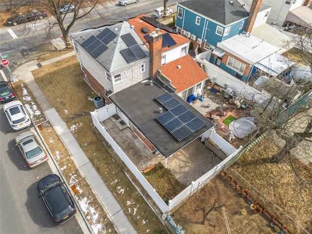 birds eye view of property with a residential view