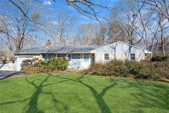 single story home with fence, driveway, a chimney, a front lawn, and a garage